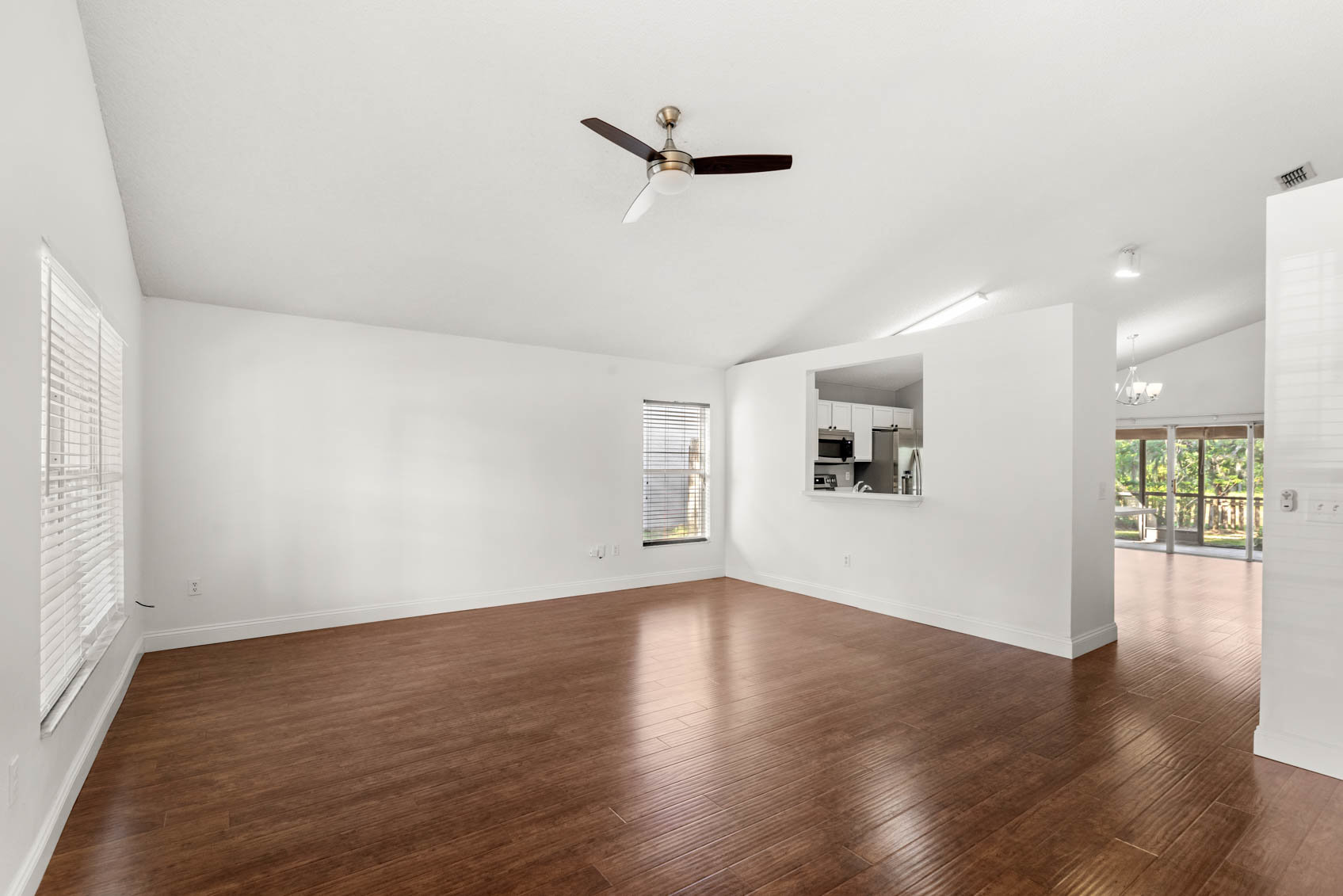 living room with wooden floors and white walls